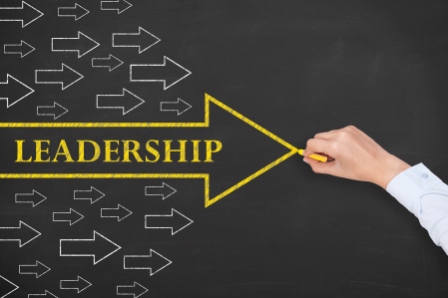 Leadership in a bright yellow arrow with smaller white arrows beside it